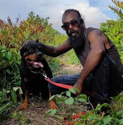 Suraj Pops with his pet dog