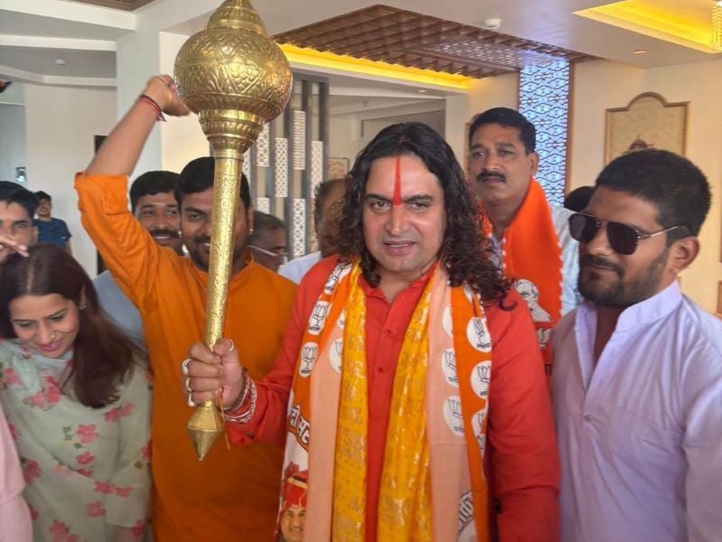 Swami Balmukundacharya holding a mace