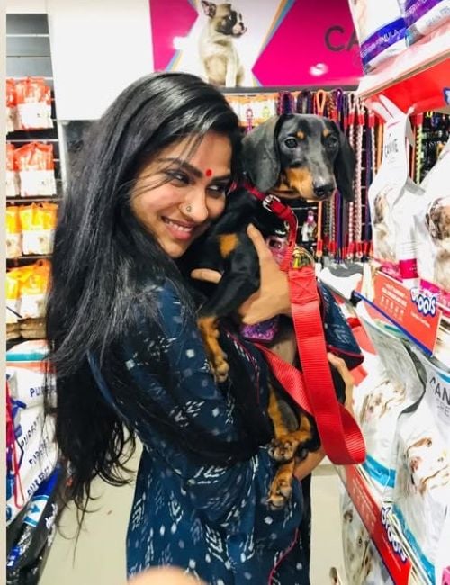 Swasika with one of her dogs