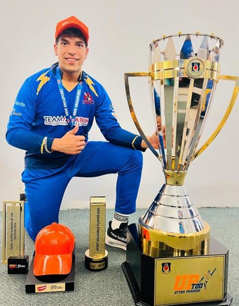 Swastik Chikara with trophies he won in 2024 UPT20 tournament
