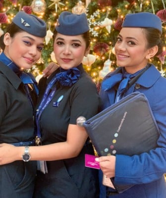 Swati Asthana (middle) posing as a fight attendant