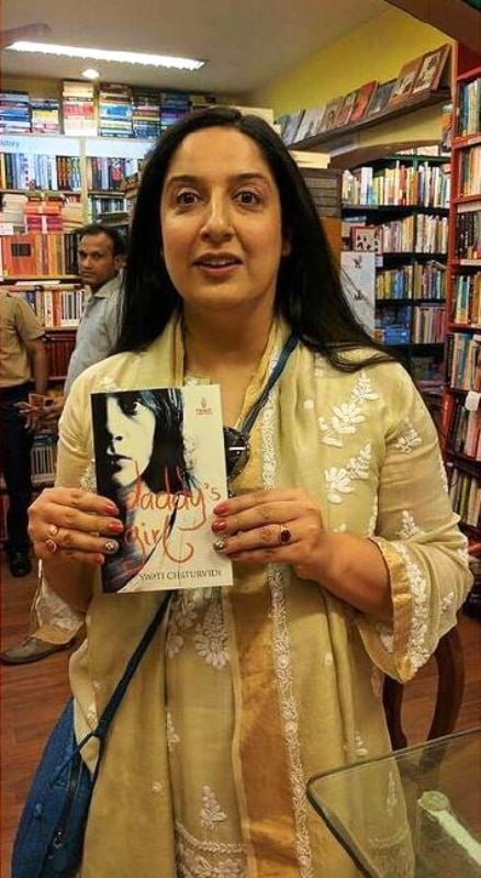 Swati Chaturvedi holding her debut book Daddy