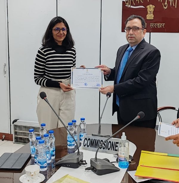 Swati Maliwal while receiving the membership certificate from the returning officer Ashish Kundra on 12 January 2024