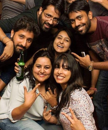 Swati Tarar holding a bottle of beer