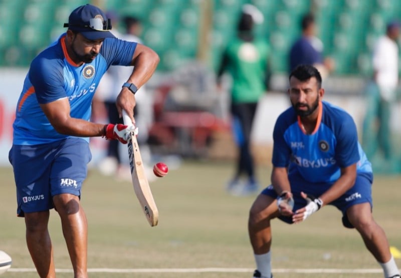 T Dilip and Cheteshwar Pujara (right) during a fielding session