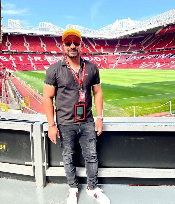 T Dilip during a trip to Manchester United Stadium, Old Trafford