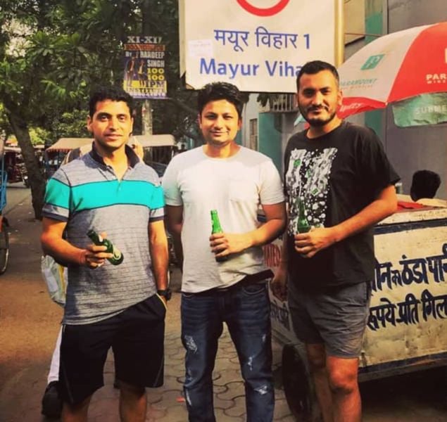 Tabish Husain (centre) drinking beer with his friends