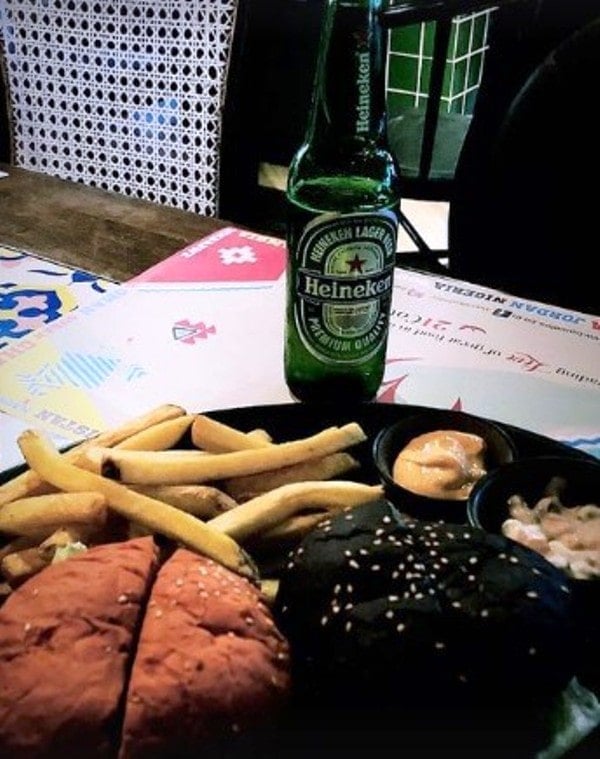 Tanish Ghorpade enjoying his food and beer