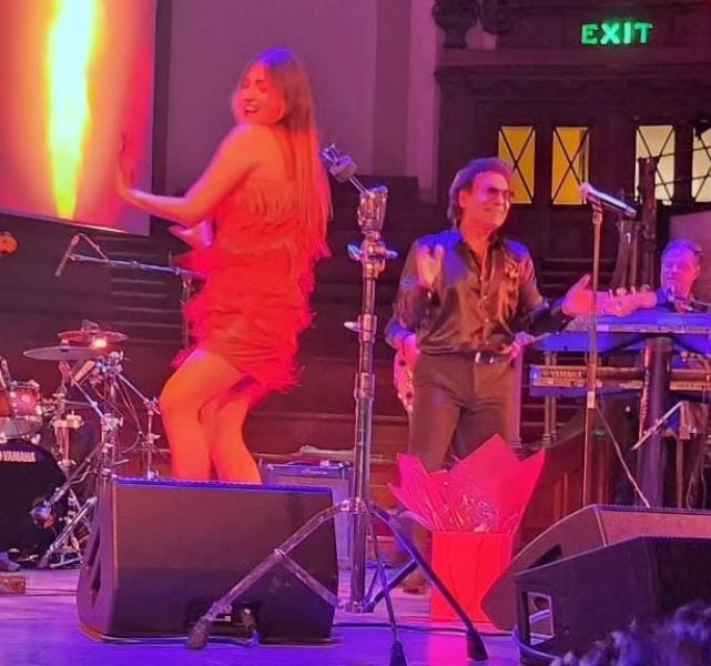 Tannaz Davoodi (left) while performing in the live concert of Andy