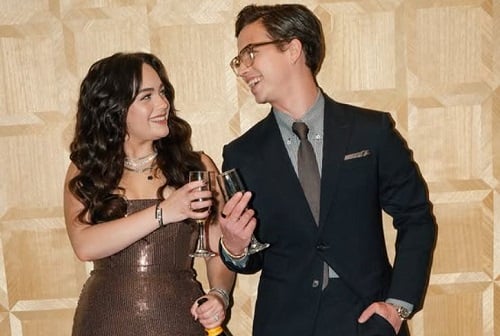 Tanner Buchanan holding a glass of alcohol