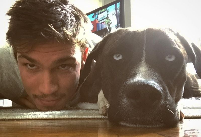 Tanner Novlan with his pet dog