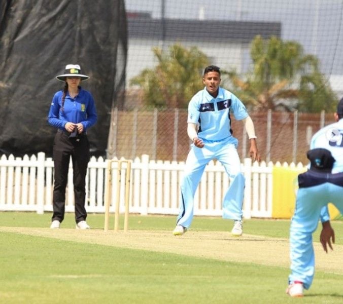 Tanveer Sangha playing in a domestic match