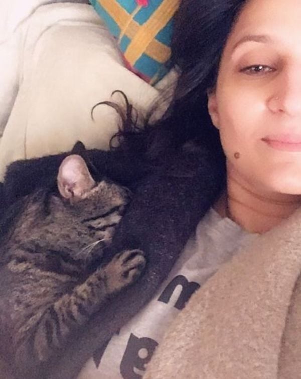 Tara Mahmood snuggling with her pet cat
