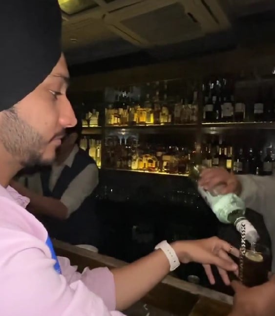 Taran Singh while enjoying an alcoholic beverage