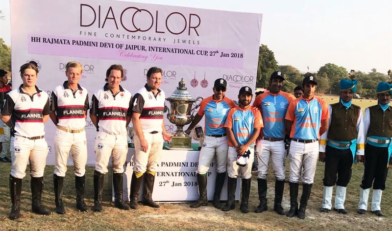Team of the Sona company posing for a photo with the cup along with the British team