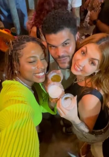 Thamiris Maia holding a glass of alcohol