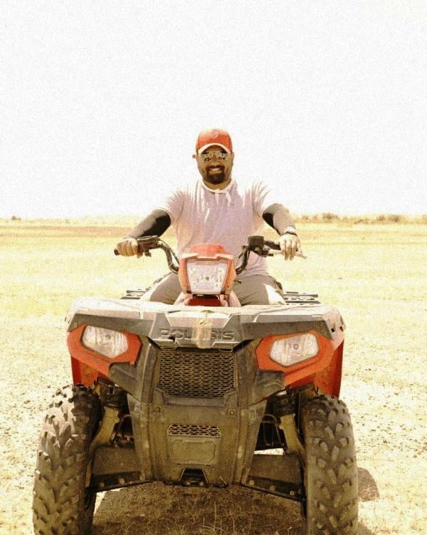 Tharun Sudhir while riding an ATV bike