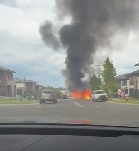 The two suspected vehicles to be linked to the crime while burning on a nearby street