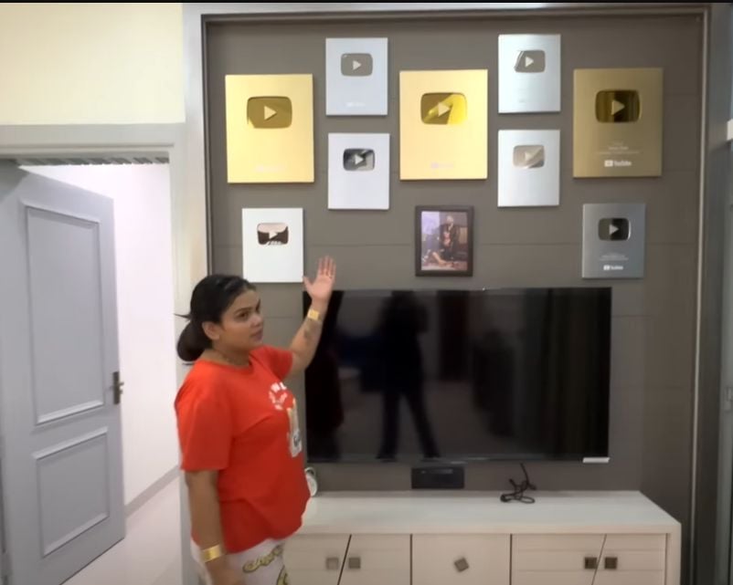The wall of YouTube accolades at the Malik