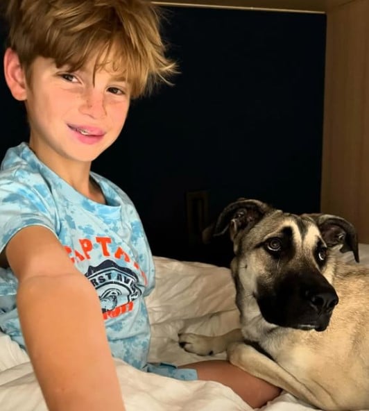 Theodore James Kushner posing with his pet