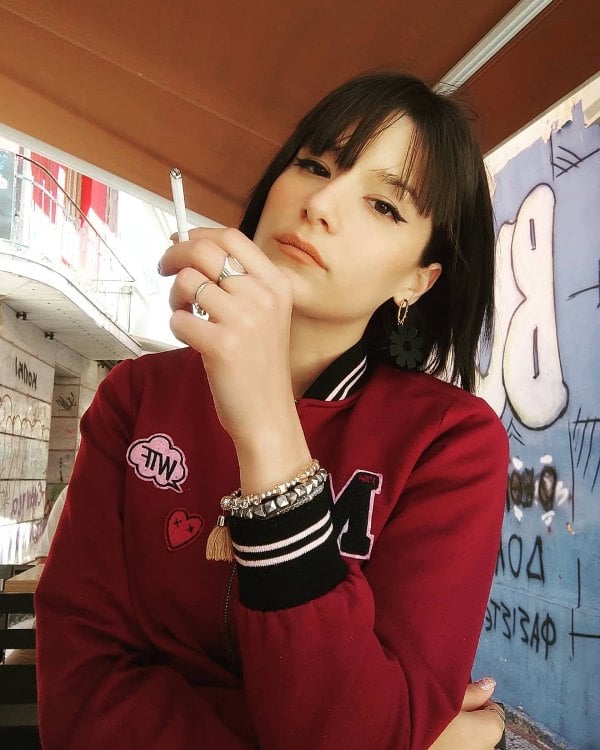 Theophania Nikolaidis while smoking a cigarette
