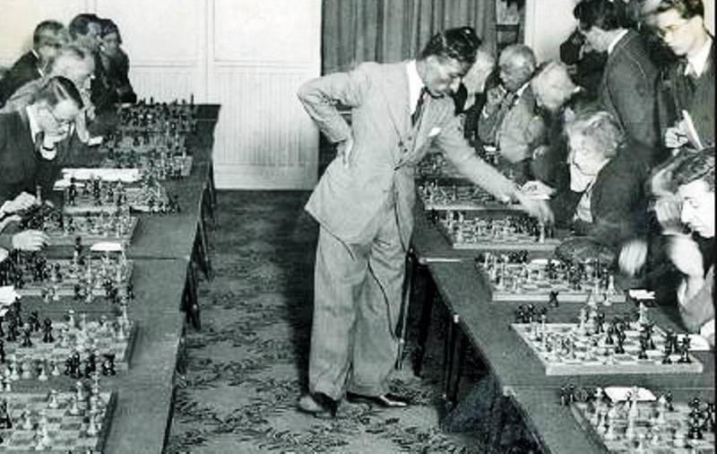 This 1931 photo shows chess champion of Great Britain, Mir Sultan Khan, playing twenty-four games simultaneously at the Empire Chess Club
