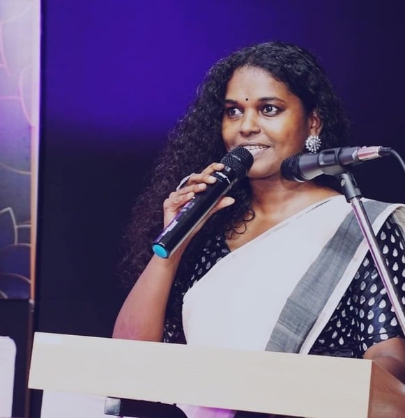 Tintumol Joseph hosting an event at Delhi Malayalee Association