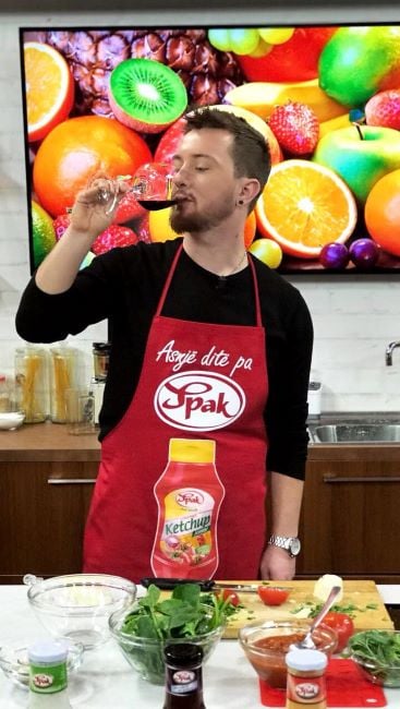 Tiri Gjoci drinking wine