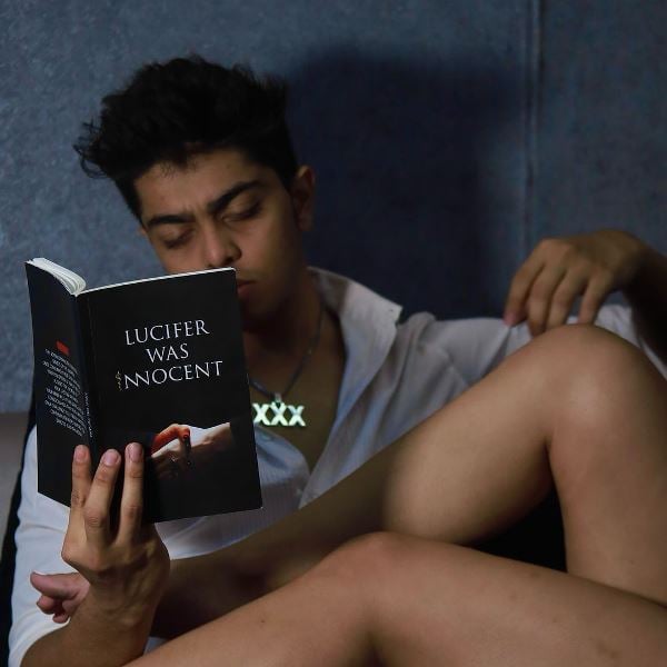 Tirth Parsana posing with his novel