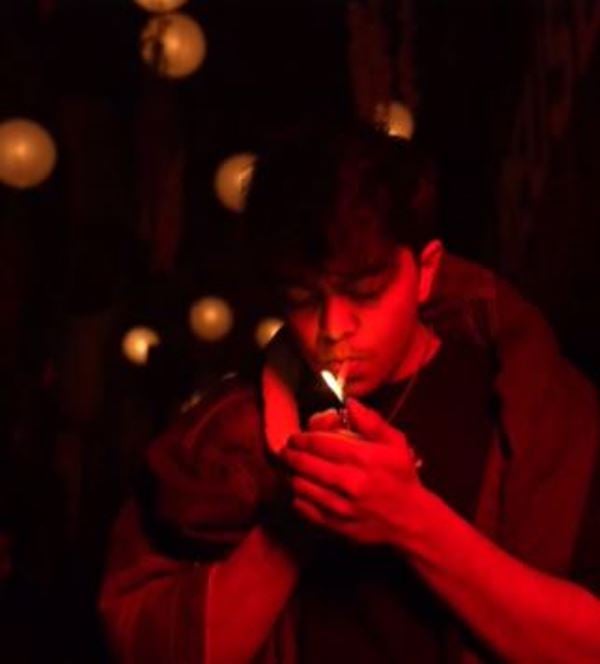 Tirth Parsana smoking in a still from one of his videos