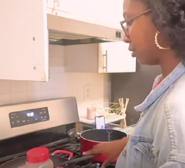 T’kor Clottey while cooking food at home