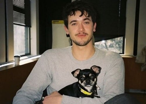 Tom Blyth with a dog