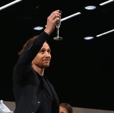 Tom Hiddleston while enjoying a glass of alcohol