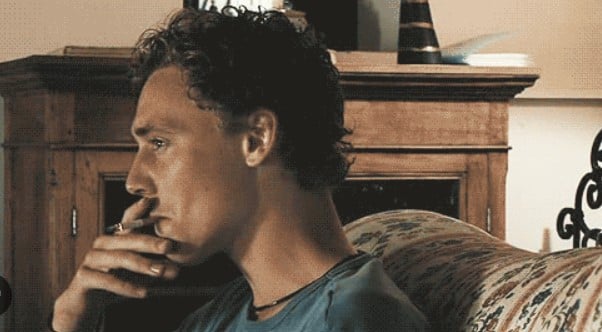 Tom Hiddleston while smoking a cigarette
