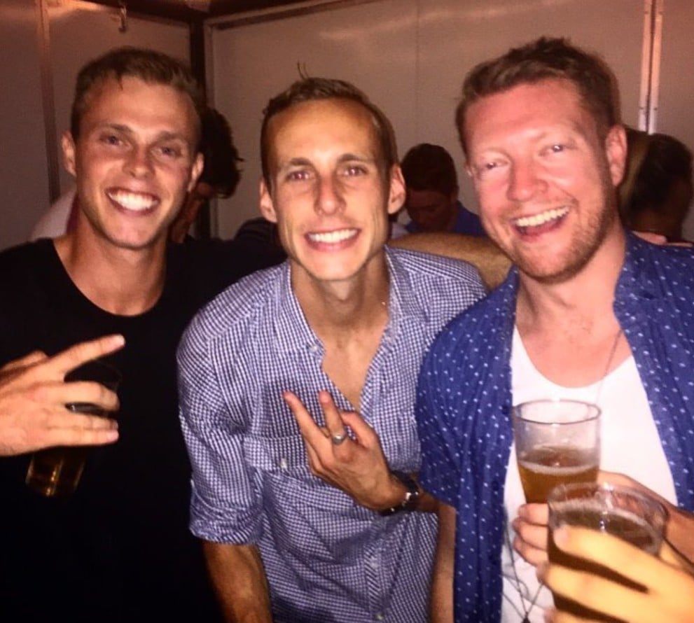 Tommy Oswald (left), while enjoying an alcoholic drink with his friends