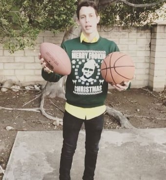 Tony Hinchcliffe posing with a basketball