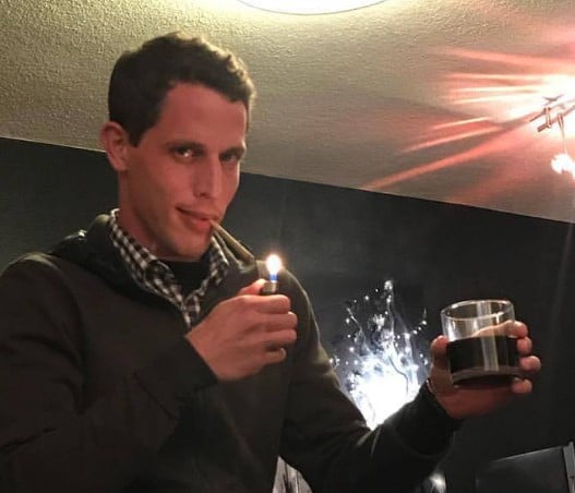 Tony Hinchcliffe while smoking cigarette and drinking alcohol