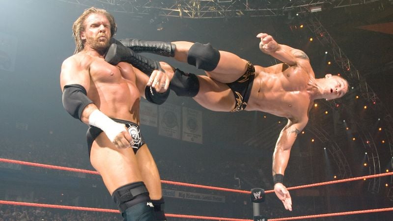 Triple H against Randy Orton during their WWE Championship title match