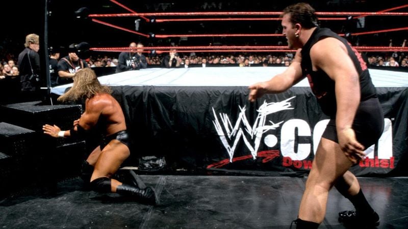 Triple H being slammed into the steel stairs by The Big Show during one of their matches