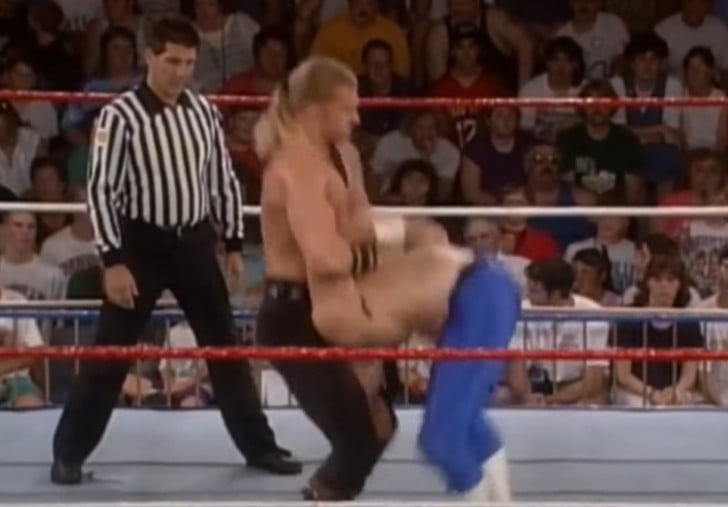 Triple H performing his signature move Pedigree at WCW