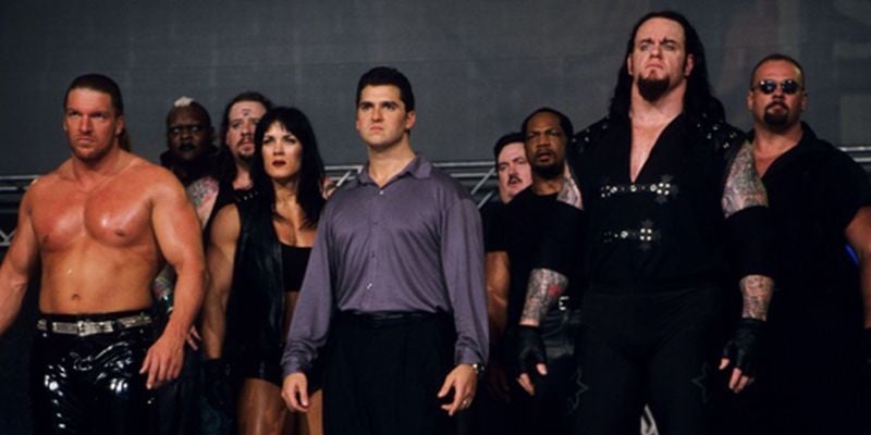 Triple H with all the members of the stable, The Corporation