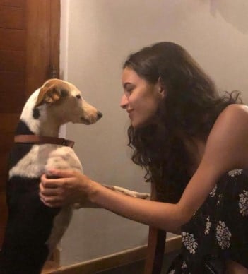 Tripti Dimri posing with one of her pet dogs