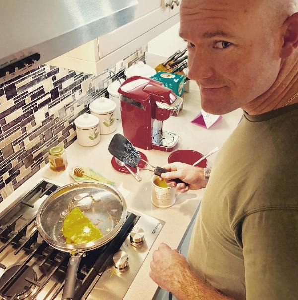 Ty Carter preparing a recipe in his kitchen