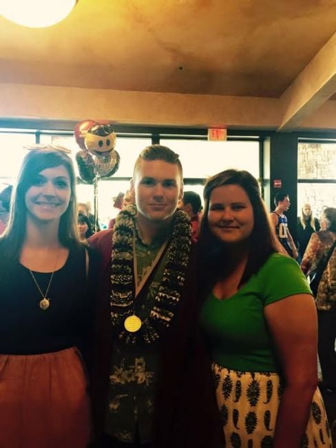 Tyler Breshears with his sisters after winning the Best in Performing Arts award