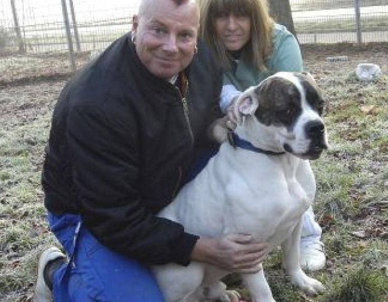 Ulf Franz petting a dog at The Dormagen animal shelter