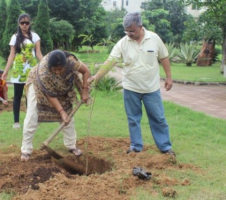 Umesh Upadhyay while planting a sapling with his family