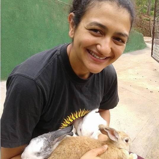 Urmila Rosario playing with rabbits