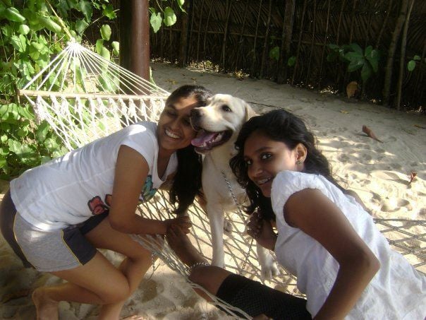 Uthara Krishnan and her sister with a dog