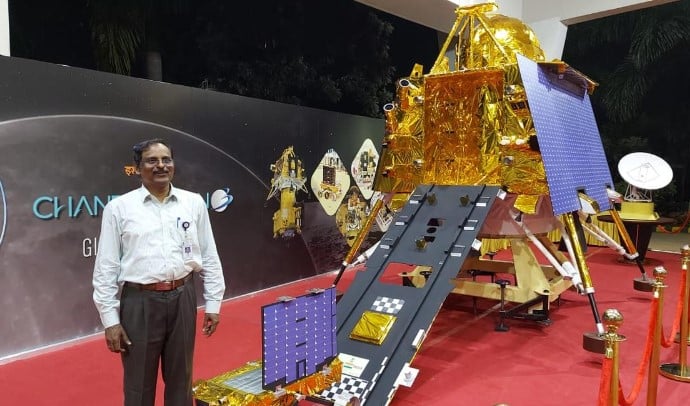 V Narayanan while posing near a model of the Chandrayaan-3 moon lander