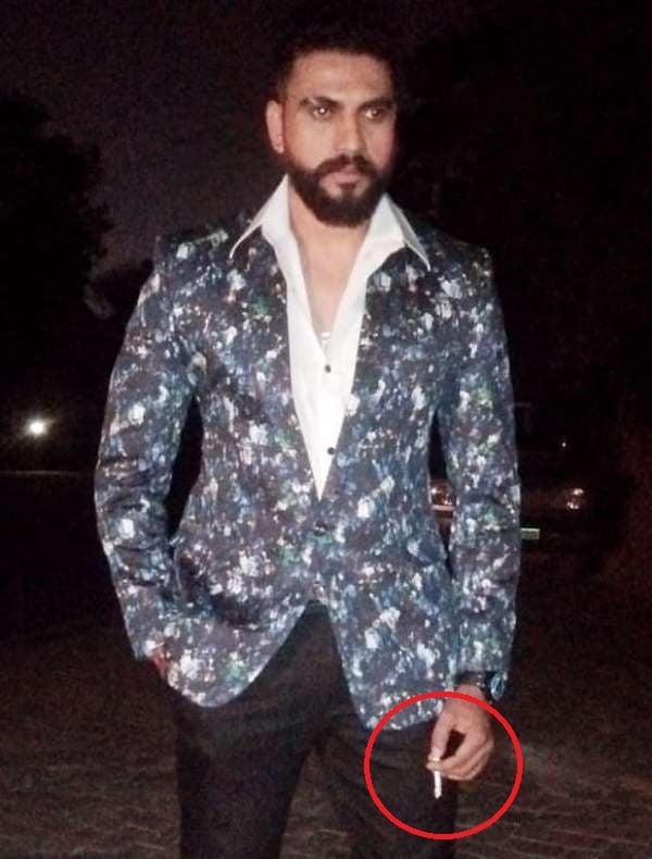 Vajrang Shetty holding a cigarette